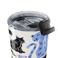 Tumbler with cat designs on a white background