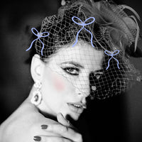 a woman model dressed in a nice hat