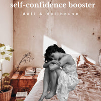 Person sitting on a bed with text 'self-confidence booster' and 'doll & dollhouse' in a bedroom setting.
