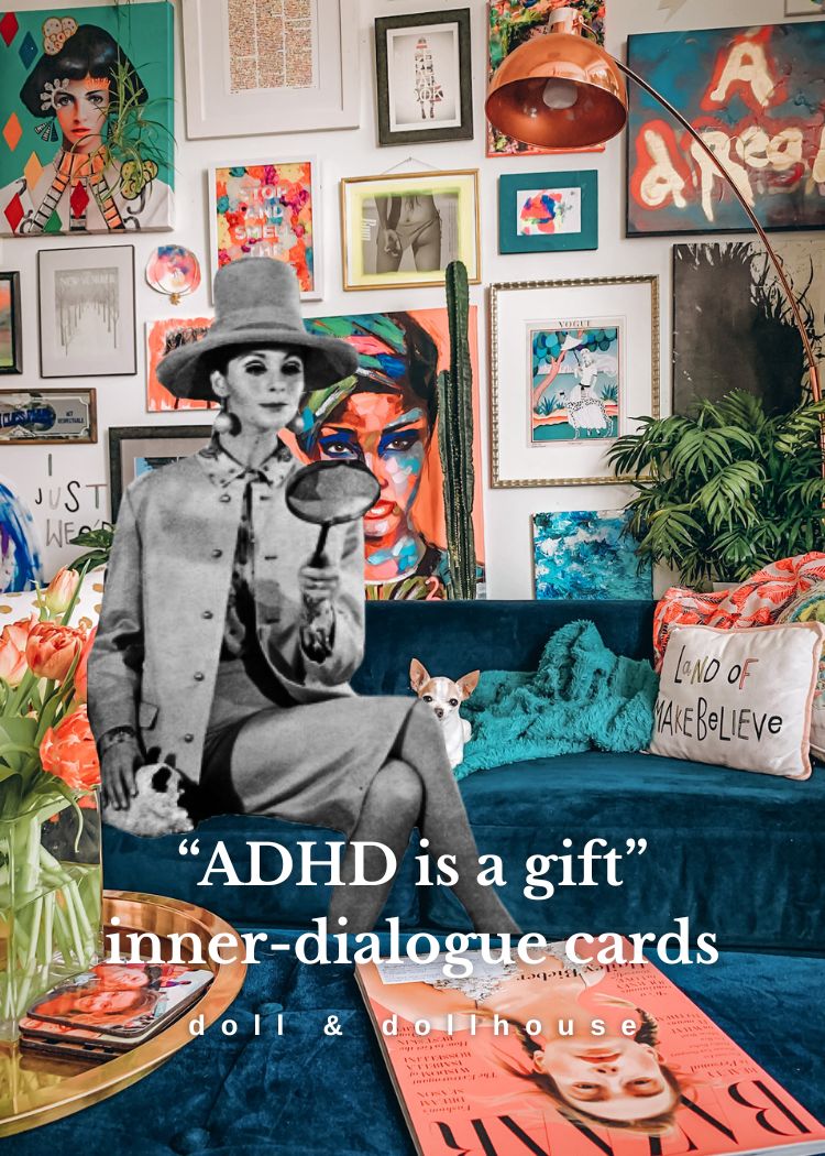 Living room with colorful artwork, a blue couch, and a vintage-style card with text.