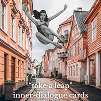 Street scene with a person leaping in the air, overlaid with text 'take a leap' and 'inner dialogue cards'.