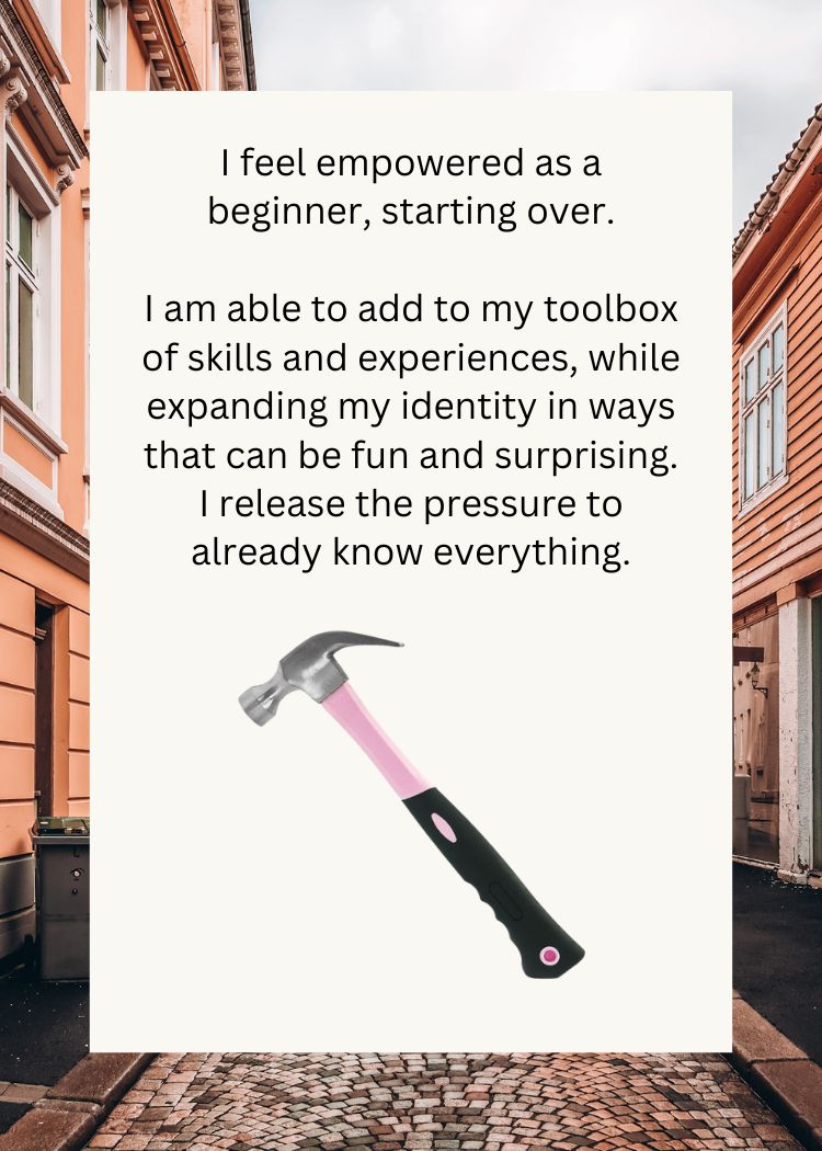Pink hammer with text about empowerment and personal growth on a blurred street background
