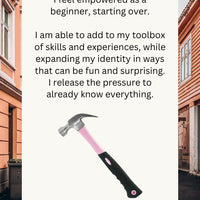 Pink hammer with text about empowerment and personal growth on a blurred street background